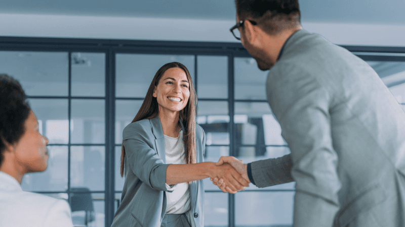 Professionals Shaking Hands in Job Interview