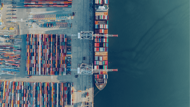 Aerial View Of Shipping Containers At The Port Of Southampton Representing Procurement And Global Supply Chain Disruption